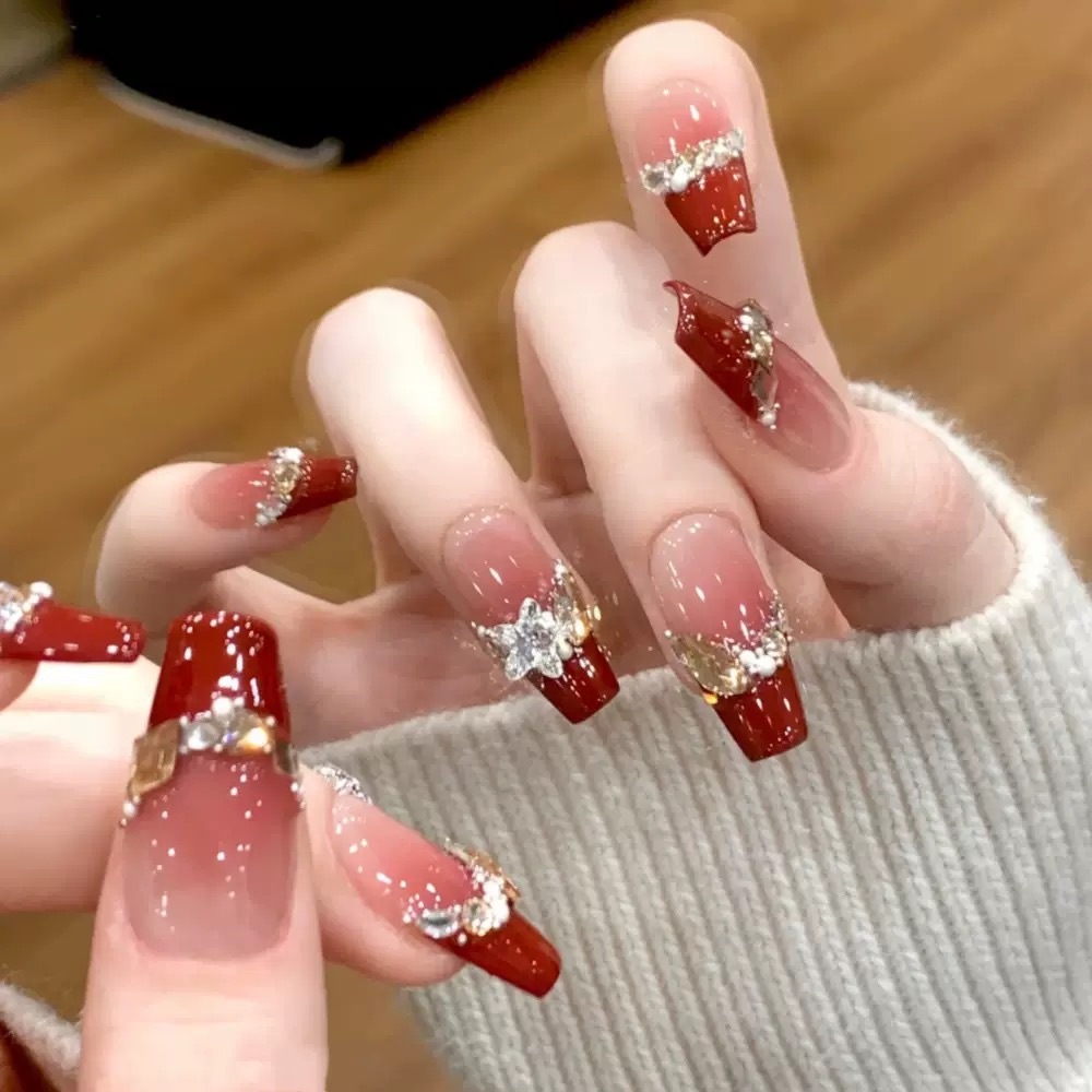 Berry red French press-on nails with sparkling gems