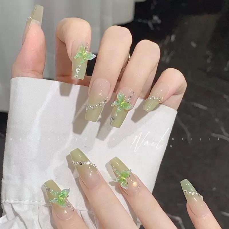 Emerald butterfly manicure detail